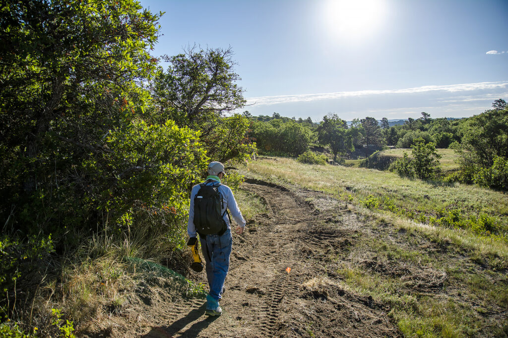 Backpacker on a trail during the day